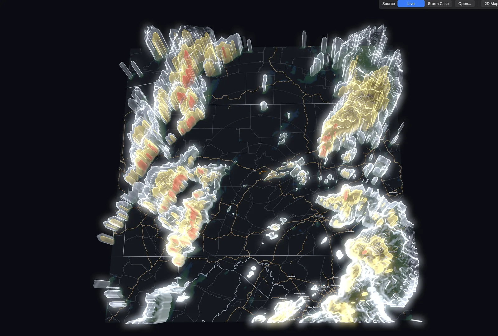 A wide overhead view of many three-dimensional storm cells rendered as translucent white, gold and red surfaces across a regional map.